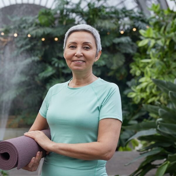 Woman smiling at private yoga session