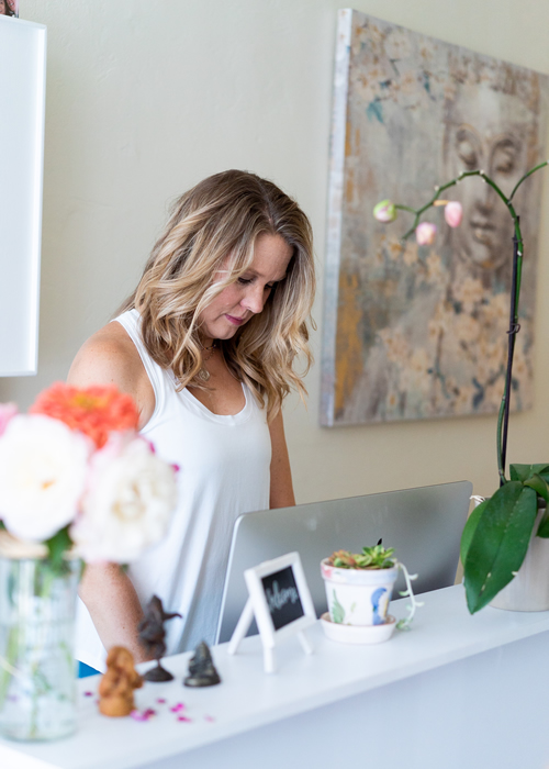 Nicole working at the front desk